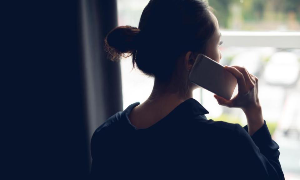 Rear view of woman talking on mobile phone