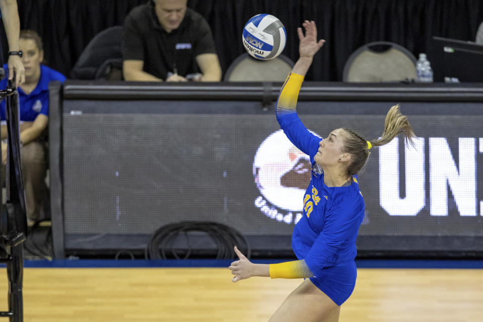 Pittsburgh's Rachel Fairbanks (10) spikes the ball Louisville in the first set during the semifinals of the NCAA volleyball tournament, Thursday, Dec. 15, 2022 in Omaha, Neb. (AP Photo/John S. Peterson)
