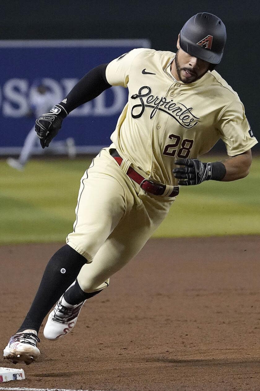 Arizona Diamondbacks' Tommy Pham rounds third base as against the Chicago Cubs.