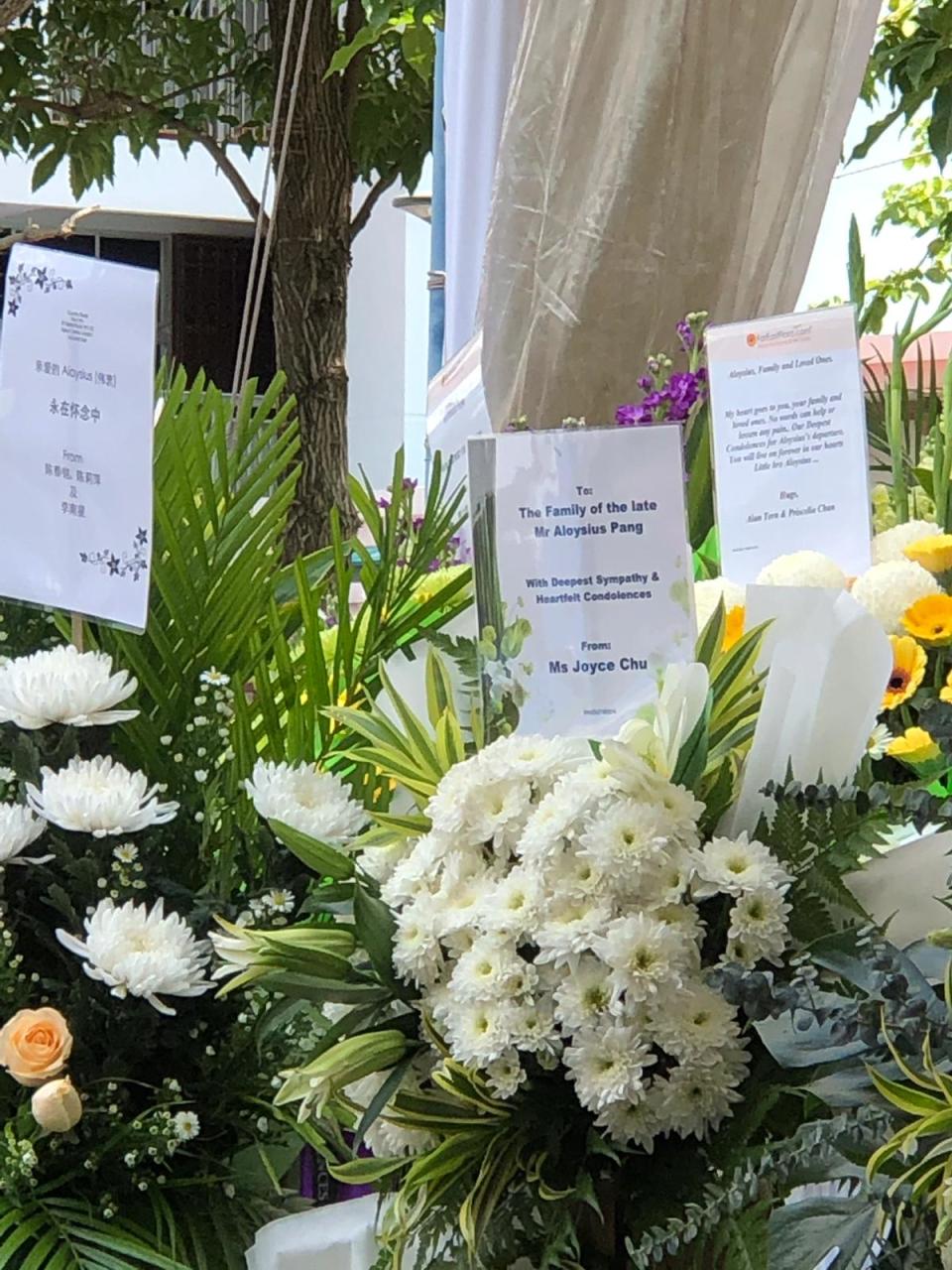 Flowers and messages from people at Aloysius Pang’s memorial on 26 January at Macpherson Lane. (PHOTO: Yahoo Lifestyle Singapore)