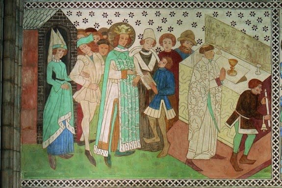 A mural painting, displayed in Uppsala Cathedral, of King Erik during mass.