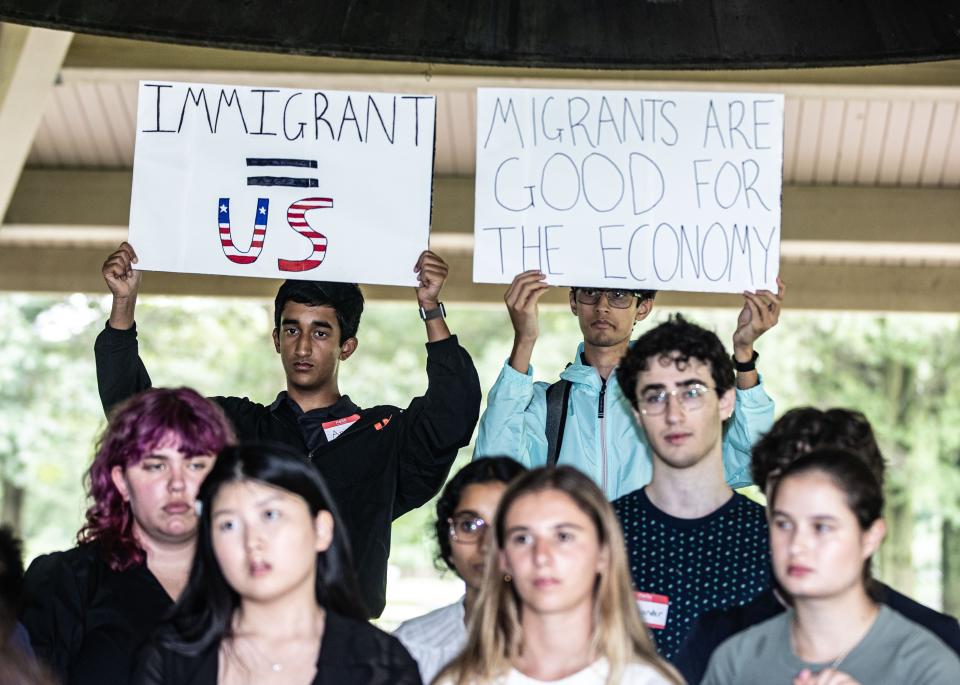 Arjun Rajdev, 16, left, and Sartthak Bagchi, 17, hold signs as they other members of the Greenburgh Town Hall Summer Internship Program, along with Rep. Jamaal Bowman, who represents New YorkÕs 17th Congressional District, speak at Macy Park in Ardsley Aug. 15, 2023 about issues facing asylum seekers, and especially those who have been sent from New York City to Westchester County. Members of the Greenburgh internship program have been volunteering to assist asylum seekers who are being housed at the Ardsley Acres Motel. 