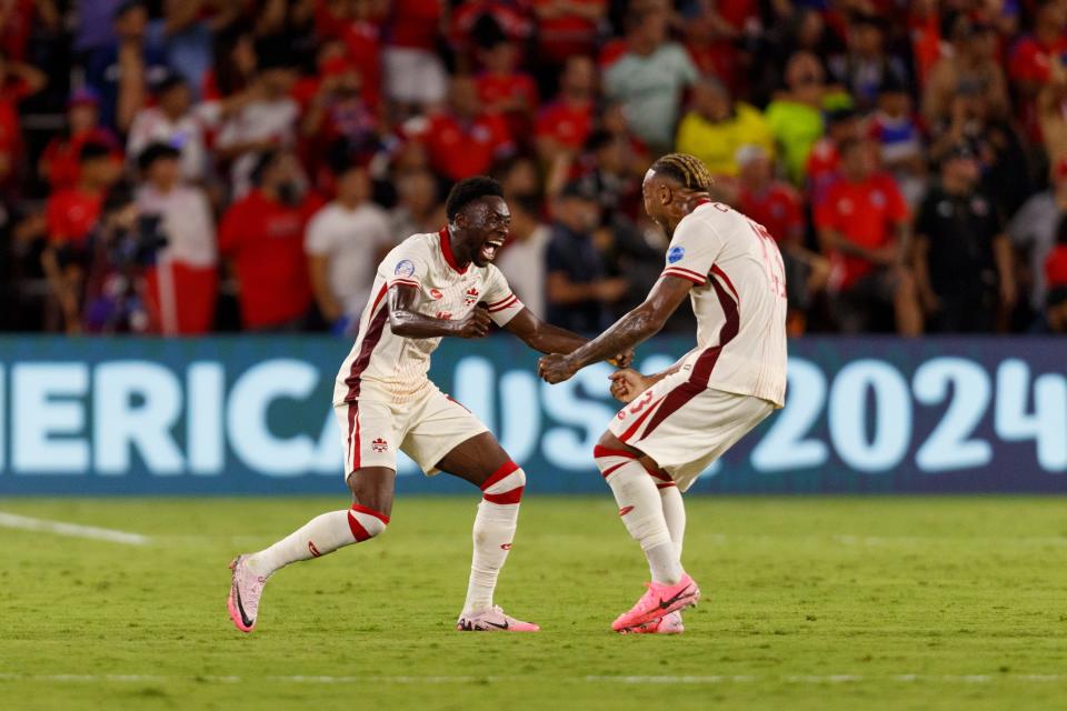 Jun 29, 2024; Orlando, FL, USA; Canada defender Alphonso Davies (19) and defender Derek Cornelius (13) celebrate a goal that was called offside during the second half at Inter&Co Stadium. Mandatory Credit: Morgan Tencza-USA TODAY Sports