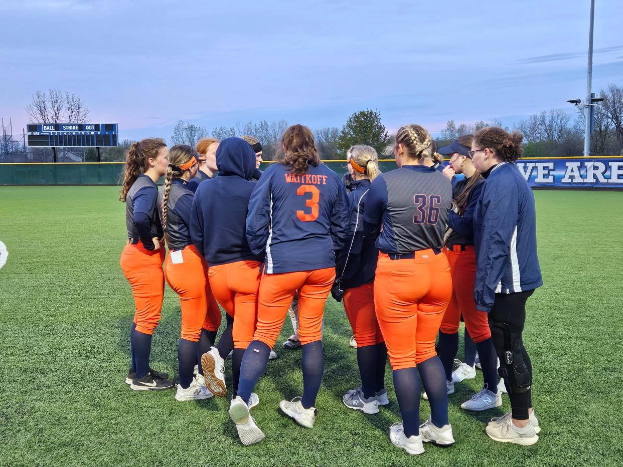 Harrison softball holds a players only discussion in St. John's, Ind. after falling to Lake Central High School on a road 10-0 in five innings.
