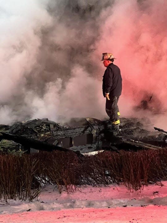 Mackinac Island Fire Chief Jason St. Onge stands at the site of a home fire on March 15, 2022. This fire was not the result of an e-bike battery.