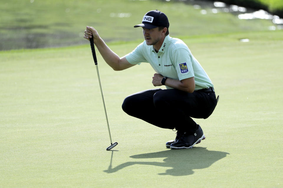 Mackenzie Hughes, of Canada, lines up his putt on the 17th green during the second round of the Travelers Championship golf tournament at TPC River Highlands, Friday, June 26, 2020, in Cromwell, Conn. (AP Photo/Frank Franklin II)