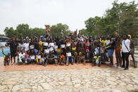 Participants pose for a group photograph of the Black Star polo community at the University of Ghana during the Black Star polo competition in Accra, Ghana, Saturday, Jan. 14, 2023. (AP Photo/Misper Apawu)