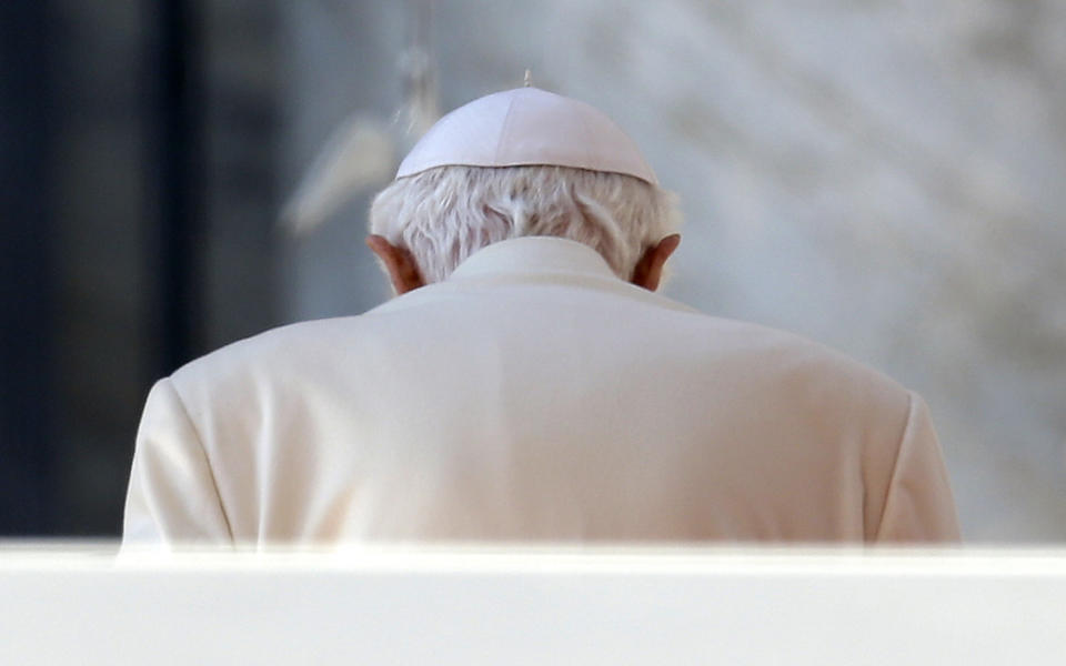 FILE - Pope Benedict XVI leaves after celebrating his final general audience before his retirement, in St. Peter's Square at the Vatican, Wednesday, Feb. 27, 2013. (AP Photo/Gregorio Borgia, File)