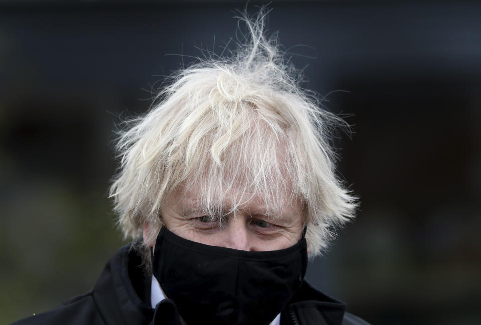 Britain's Prime Minister Boris Johnson during a visit to a DIY shop in Middlesbrough, England, Thursday, April 1, 2021. (AP Photo/Scott Heppell, pool)