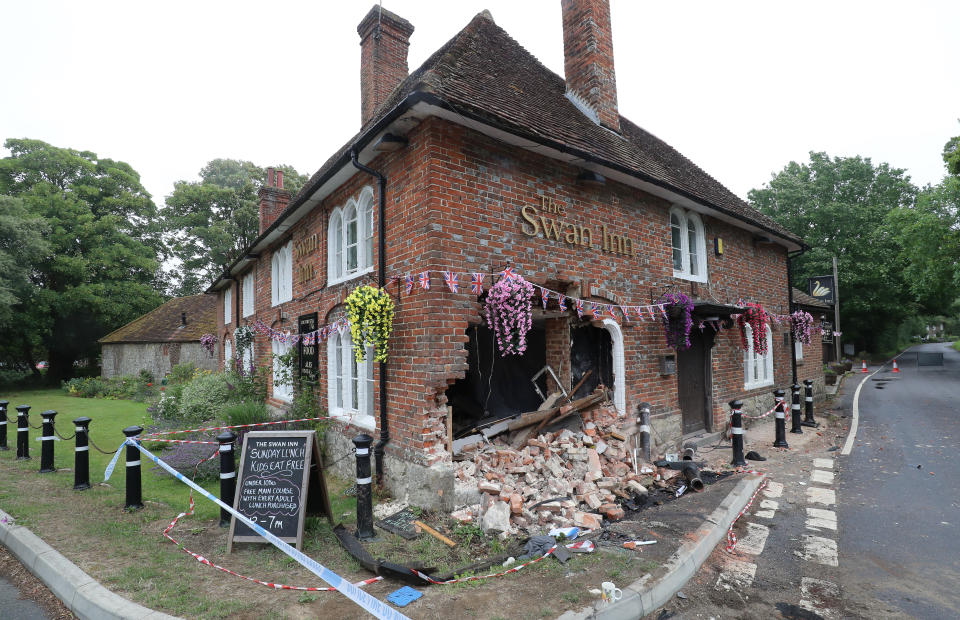 A view of scene outside The Swan Inn in Ashford, Kent, after a car crashed into the pub during the early hours of this morning wrecking their plans for reopening as coronavirus lockdown restrictions are eased across England.