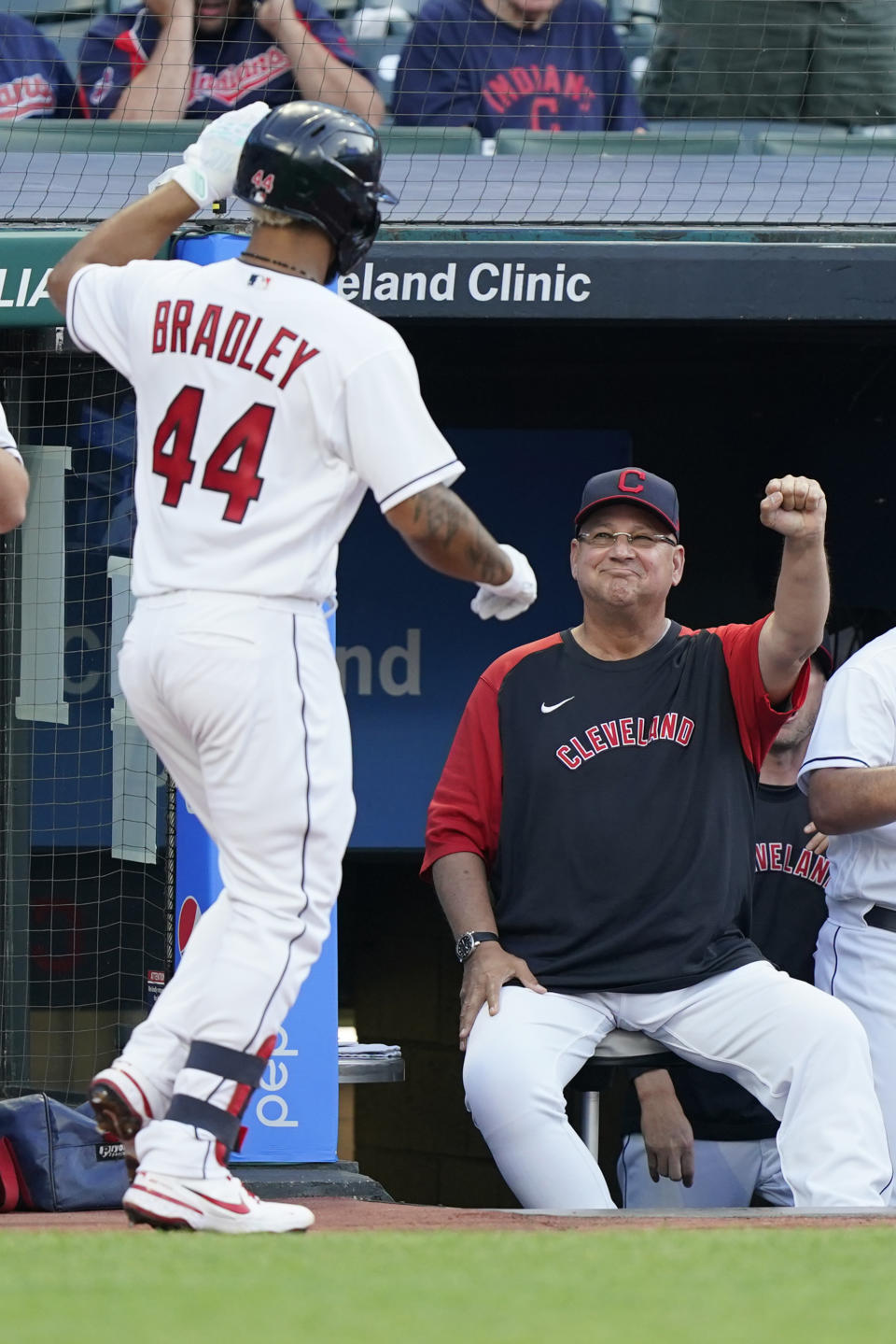 Cleveland Indians manager Terry Francona, right, congratulates Bobby Bradley after Bradley hit a solo home run during the third inning of the team's baseball game against the Seattle Mariners, Friday, June 11, 2021, in Cleveland. (AP Photo/Tony Dejak)