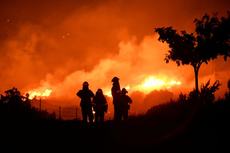 FILE PHOTO: Wildfire in California burns through the night north of Los Angeles