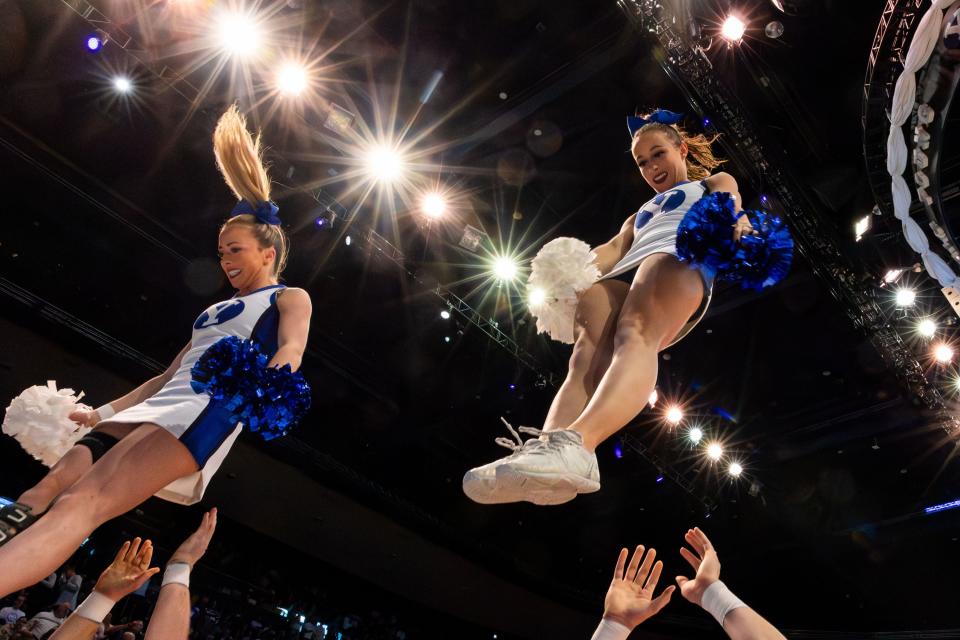 Brigham Young Cougars cheerleaders are stunted during a men’s college basketball game between Brigham Young University and Baylor University at the Marriott Center in Provo on Tuesday, Feb. 20, 2024. | Megan Nielsen, Deseret News