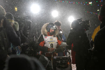Pete Kaiser of of Bethel, Alaska crosses the finish line to win the Iditarod Trail Sled Dog Race in Nome, Alaska, U.S. March 13, 2019. REUTERS/Diana Haecker/Nome Nugget