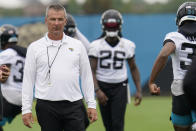 Jacksonville Jaguars head coach Urban Meyer, left, watches players perform drills during an NFL football practice, Monday, June 14, 2021, in Jacksonville, Fla. (AP Photo/John Raoux)