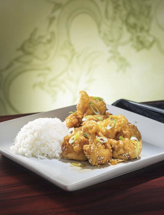 Honey Sesame Chicken is just one of 100 recipes in "The Unofficial Disney Parks EPCOT Cookbook" by Ashley Craft.