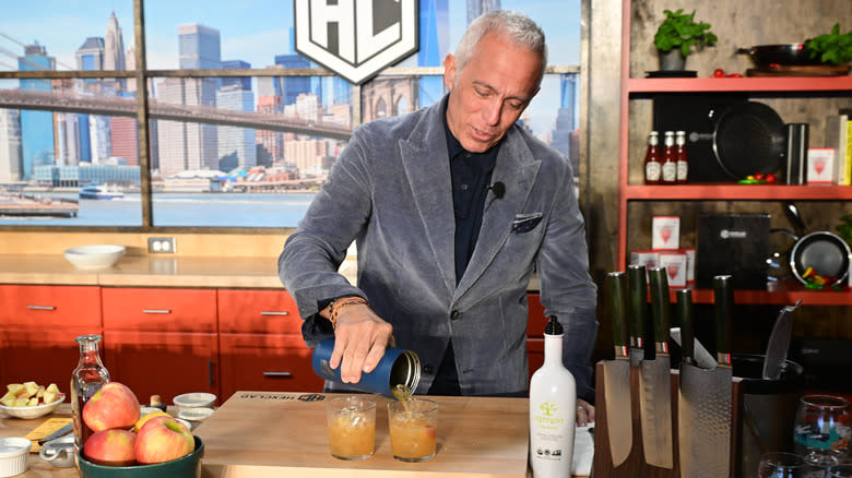 Geoffrey Zakarian pouring cocktails