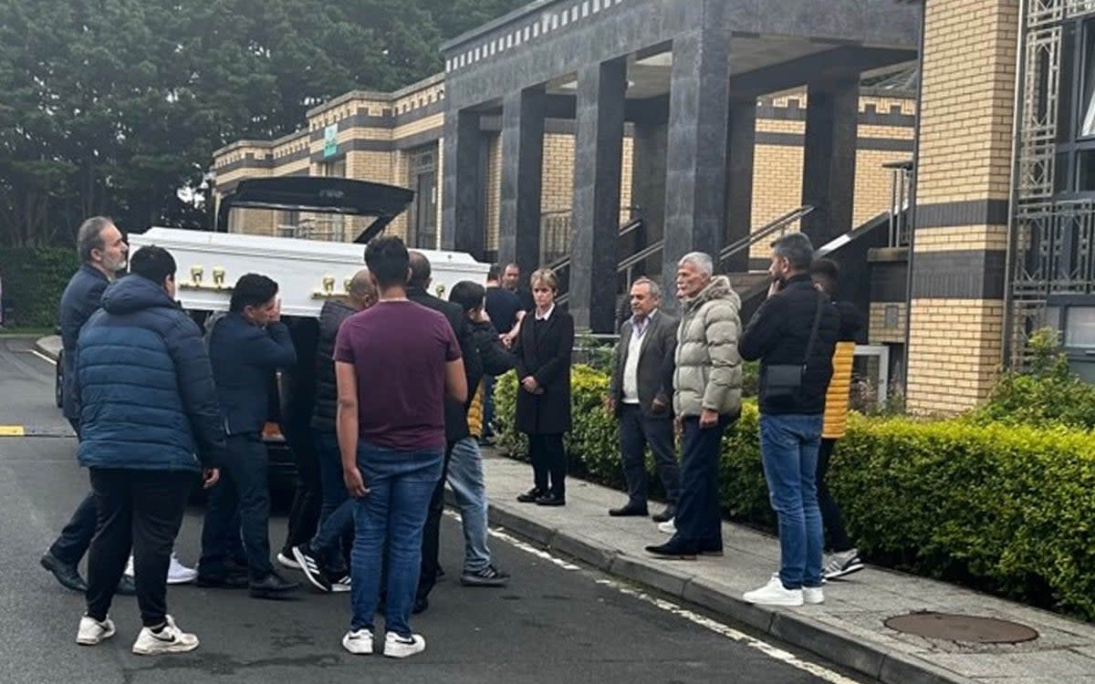 Pallbearers carry Dlava’s coffin into the Islamic Cultural Centre in Dublin (PA)