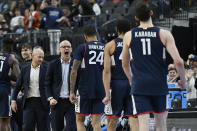 UConn head coach Dan Hurley, middle, celebrates towards his players in the second half of an Elite 8 college basketball game against Gonzaga in the West Region final of the NCAA Tournament, Saturday, March 25, 2023, in Las Vegas. (AP Photo/David Becker)