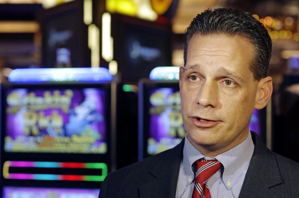 Matt Schuler, executive director of the Ohio Casino Control Commission, speaks to the media inside Horseshoe Casino Cincinnati, Tuesday, Feb. 26, 2013, in Cincinnati. The casino with a 100,000 foot gaming floor is set to open to the public Monday, March 4. (AP Photo/Al Behrman)