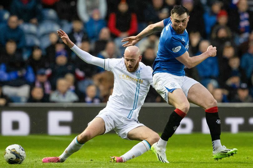 Rangers' John Souttar and Dundee's Zak Rudden in action