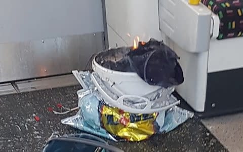 A handout picture obtained from the twitter user @sylvainpennec shows a white container burning inside a London Underground tube carriage at Parsons Green underground tube station on September 15, 2017 - Credit: AFP