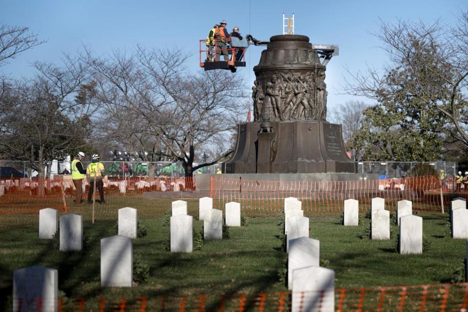 PHOTO: Workers dismantle the Confederate Memorial at Arlington National Cemetery December 20, 2023, in Arlington, Virginia. (Brendan Smialowski/AFP via Getty Images)