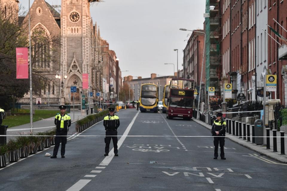Three police officers stand near the crime scene from Thursday’s stabbing on Friday in Dublin, Ireland (Getty Images)