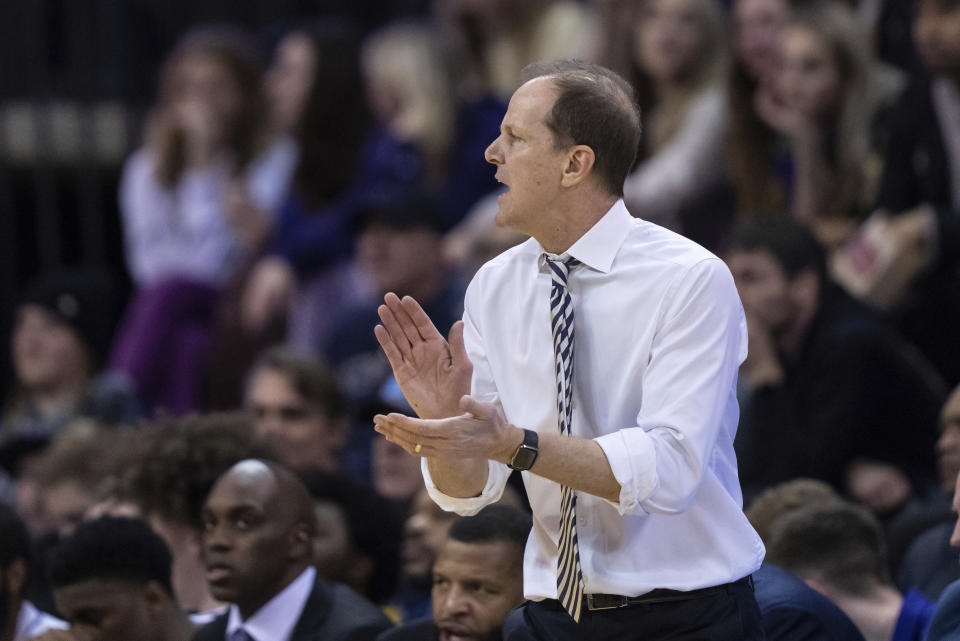 FILE - Washington coach Mike Hopkins encourages the team during the first half against Stanford in an NCAA college basketball game Jan. 12, 2023, in Seattle. Hopkins is facing increased pressure to try and get the Huskies back into the NCAA Tournament after missing the tourney the past four seasons. (AP Photo/Stephen Brashear, File)