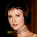 <p>Theron worked a modified Louise Brooks bob for <em>The Yards</em>, drawing emphasis to her eyes with artfully uneven micro-bangs.</p>