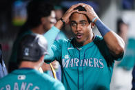 Seattle Mariners' Julio Rodríguez, right, reacts after Ty France, left, hit a two-run home run against the Arizona Diamondbacks during the seventh inning of a baseball game Saturday, April 27, 2024, in Seattle. (AP Photo/Lindsey Wasson)