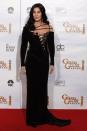 <p>In a black strappy gown at the Golden Globe Awards.</p>