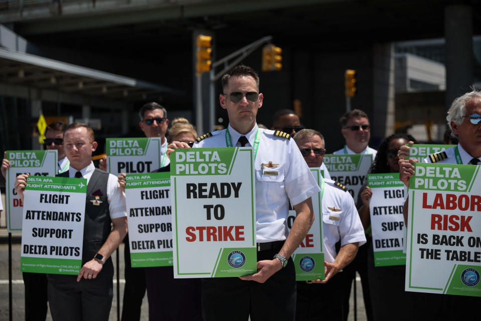 Delta Air Lines pilots, represented by the Air Line Pilots Association, protest outside Terminal 4 at JFK International airport in New York City, U.S., June 30, 2022. REUTERS/Shannon Stapleton
