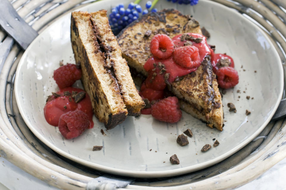 In this image taken on April 22, 2013, chocolate-stuffed French toast with raspberry sauce is shown served on a plate in Concord, N.H. (AP Photo/Matthew Mead)