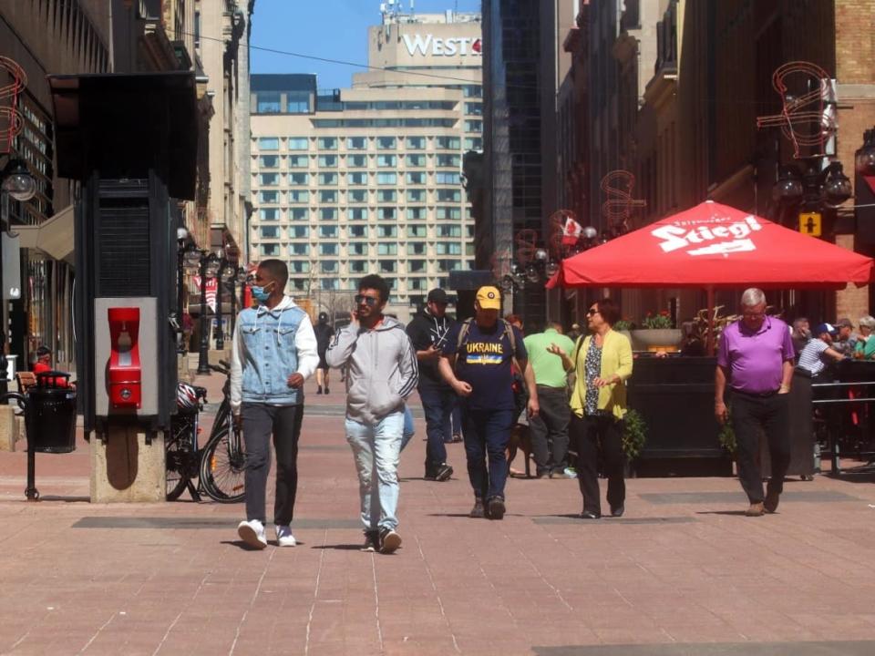 Pedestrians stroll along Sparks Street in Ottawa on Sunday during the sixth wave of the COVID-19 pandemic. (Trevor Pritchard/CBC - image credit)