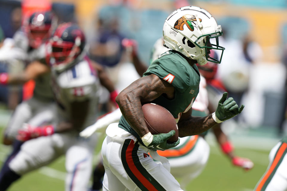 Florida A&M wide receiver Marcus Riley (4) runs to score a touchdown during the first half of the Orange Blossom Classic NCAA college football game against Jackson State, Sunday, Sept. 3, 2023, in Miami Gardens, Fla. (AP Photo/Lynne Sladky)