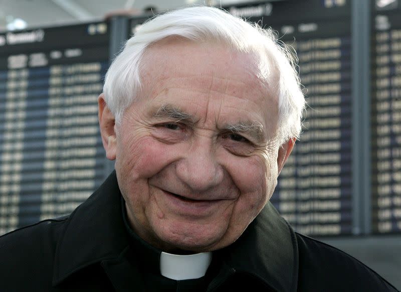 FILE PHOTO: Catholic Priest Georg Ratzinger arrives at Munich's airport to depart for Rome.