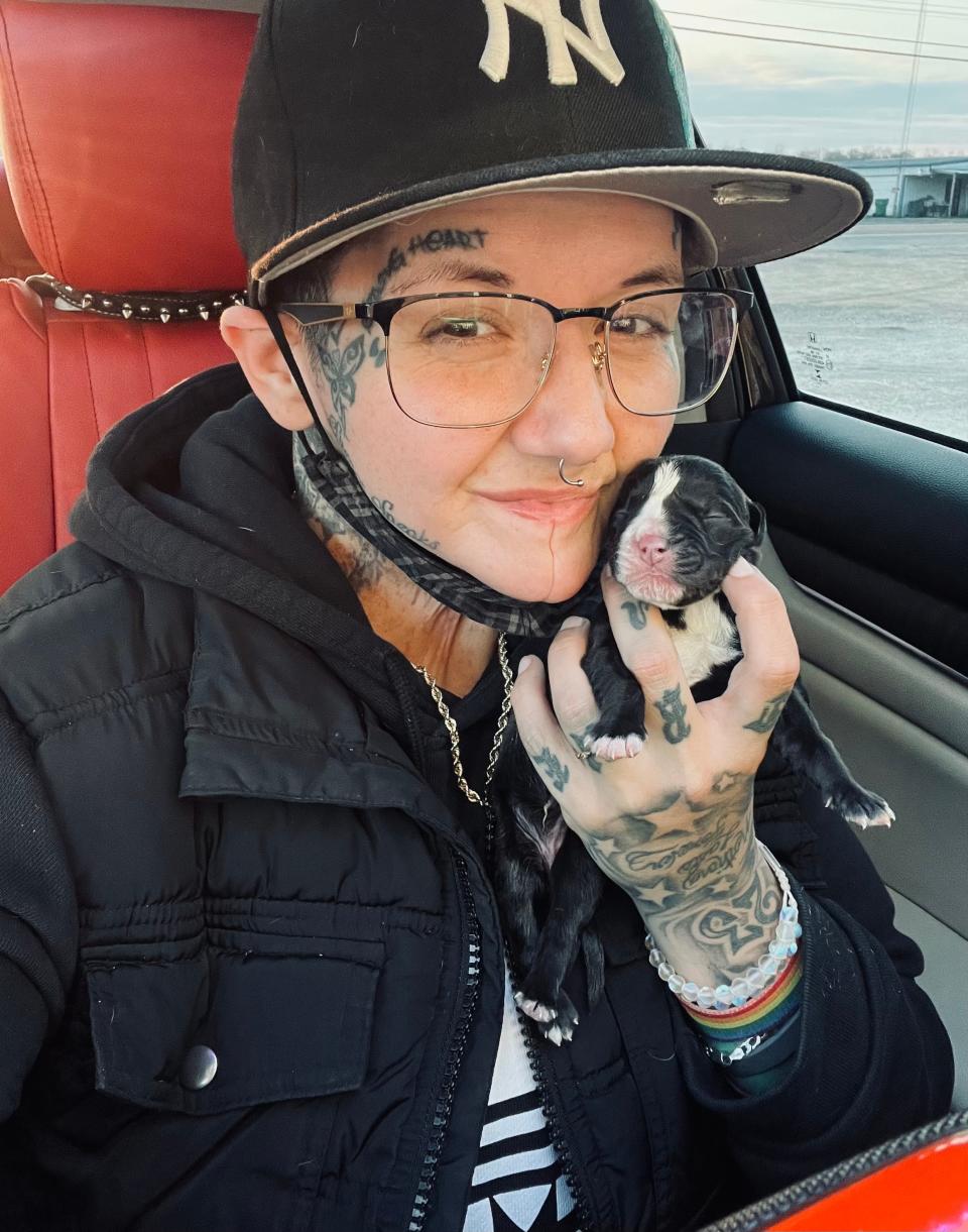 Jen Costa holds Miracle, the miracle puppy.