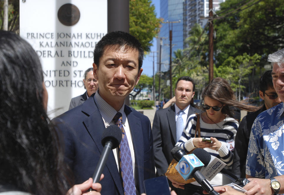 Hawaii Attorney General Douglas Chin speaks outside federal court in Honolulu, Wednesday, March 29, 2017. A federal judge in Hawaii questioned government attorneys Wednesday who urged him to narrow his order blocking President Donald Trump's travel ban because suspending the nation's refugee program has no effect on the state. U.S. District Judge Derrick Watson is hearing arguments on whether to extend his temporary order until Hawaii's lawsuit works its way through the courts. Even if he does not issue a longer-lasting hold on the ban, his temporary block would stay in place until he rules otherwise. (AP Photo/Caleb Jones)