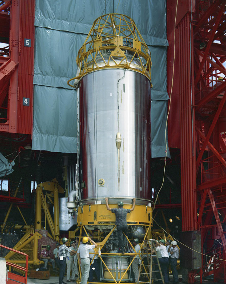 In this Aug. 13, 1965 photo provided by the San Diego Air and Space Museum, technicians work on an Atlas Centaur 7 rocket at Cape Canaveral, Fla. NASA's leading asteroid expert, Paul Chodas, speculates that asteroid 2020 SO, as it is formally known, is actually a Centaur upper rocket stage that propelled NASA’s Surveyor 2 lander to the moon in 1966 before it was discarded. (Convair/General Dynamics Astronautics Atlas Negative Collection/San Diego Air and Space Museum via AP)