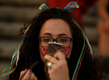 A woman paints her face during celebrations after the Maltese parliament voted to legalise same-sex marriage on the Roman Catholic Mediterranean island, in Valletta, Malta July 12, 2017. REUTERS/Darrin Zammit Lupi