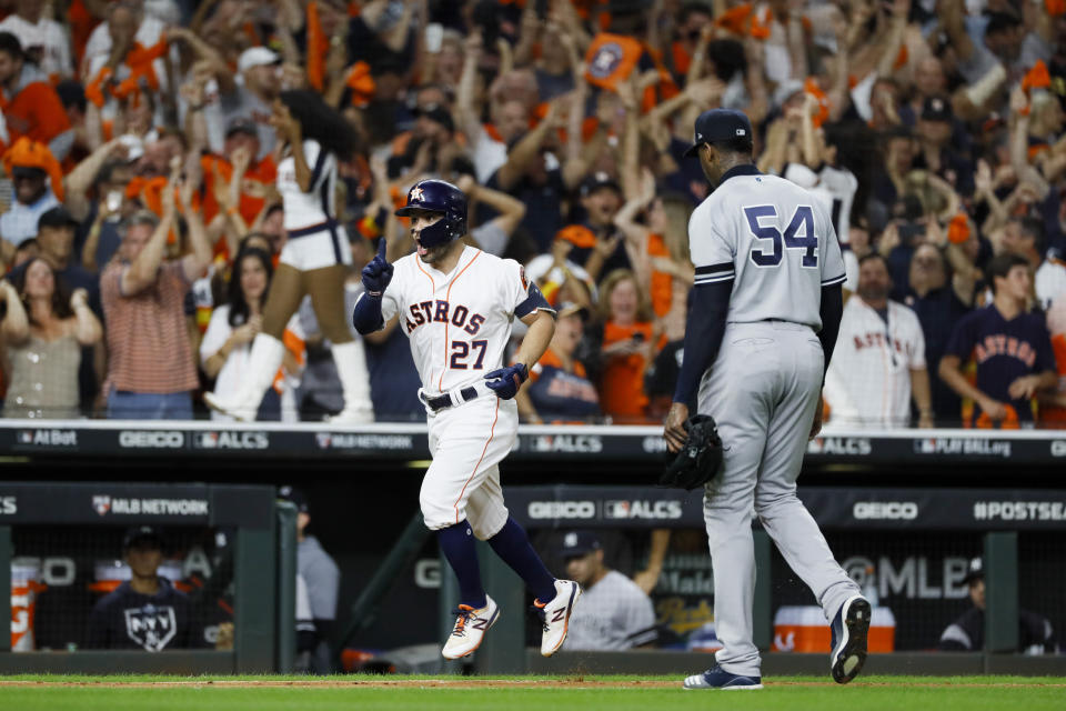 Houston Astros' Jose Altuve celebrates walk off against New York Yankees pitcher Aroldis Chapman to win Game 6 of baseball's American League Championship Series against the New York Yankees Saturday, Oct. 19, 2019, in Houston. The Astros won 6-4 to win the series 4-2. (AP Photo/Matt Slocum)