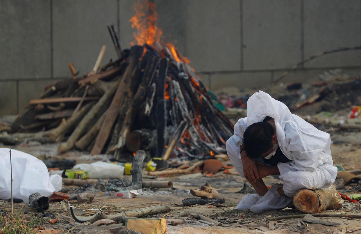 <p>Multiple bodies of Covid-19 patients burning at the cremation ground at Seemapuri, Delhi</p> (Stuti Mishra)