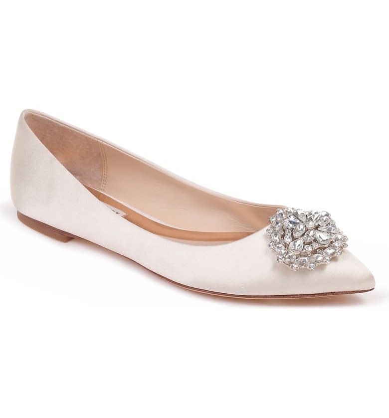 <strong>Sizes</strong>: 6 to 10<br />Get them at <a href="https://shop.nordstrom.com/s/badgley-mischka-davis-crystal-embellished-pointy-toe-flat-women/4858411?origin=category-personalizedsort&amp;breadcrumb=Home%2FWomen%2FThe%20Wedding%20Suite%2FWedding%20Shoes&amp;color=ivory%20satin" target="_blank" rel="noopener noreferrer">Nordstrom</a>.&nbsp;