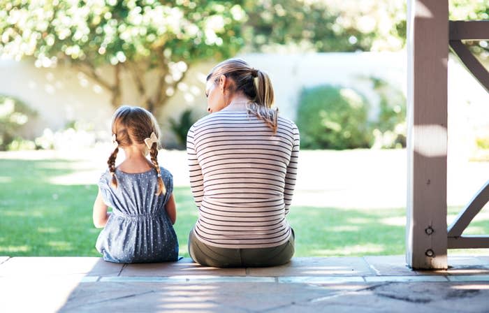 A mom talking with her elementary school–age daughter