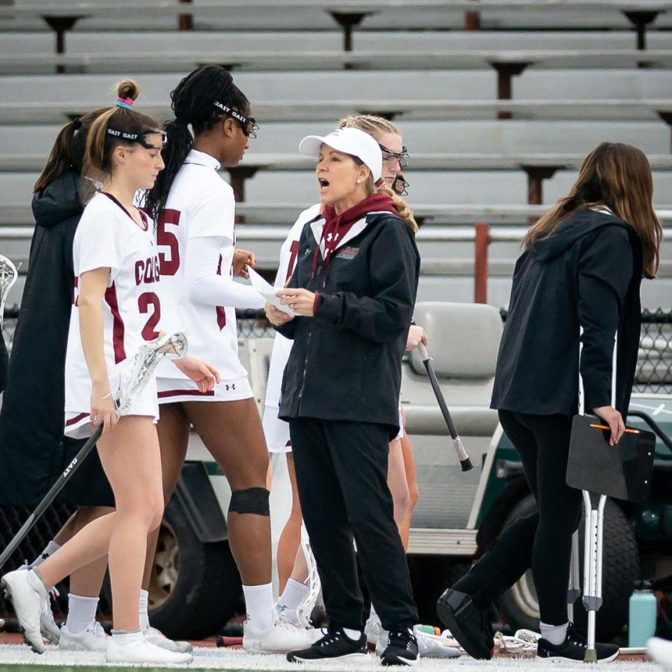 Colgate Women's Lacrosse Head Coach Kathy Taylor gives instructions to her players on the sideline during a home game at Colgate University.