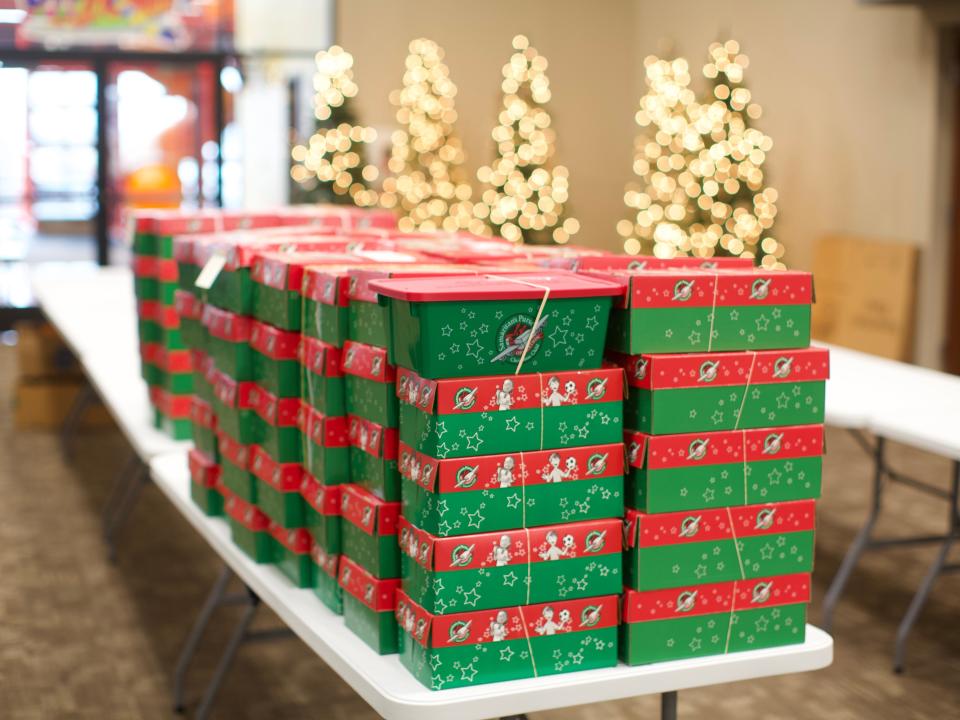 A pile of shoeboxes sat stacked in Dayspring Wesleyan Church, the official drop-off location for Marion, prior to being packed. A part of Samaritan Purse's Operation Christmas Child, the boxes will be sent all over the world to give Christmas presents to children overseas.