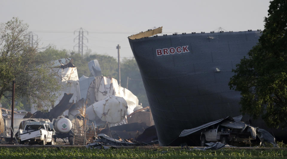 FILE - In this April 18, 2013 file photo, mangled debris of the West Fertilizer Co. plant is seen, a day after an explosion leveled the plant in West, Texas. Images of a massive explosion in the Lebanese capital looked depressingly familiar to West, Texas Mayor Tommy Muska, whose small town in 2013 was partly leveled by one of the deadliest fertilizer plant explosions in U.S. history. "I don't know what people were thinking about storing that stuff," Muska said, Wednesday, Aug. 5, 2020. (AP Photo/Charlie Riedel, File)