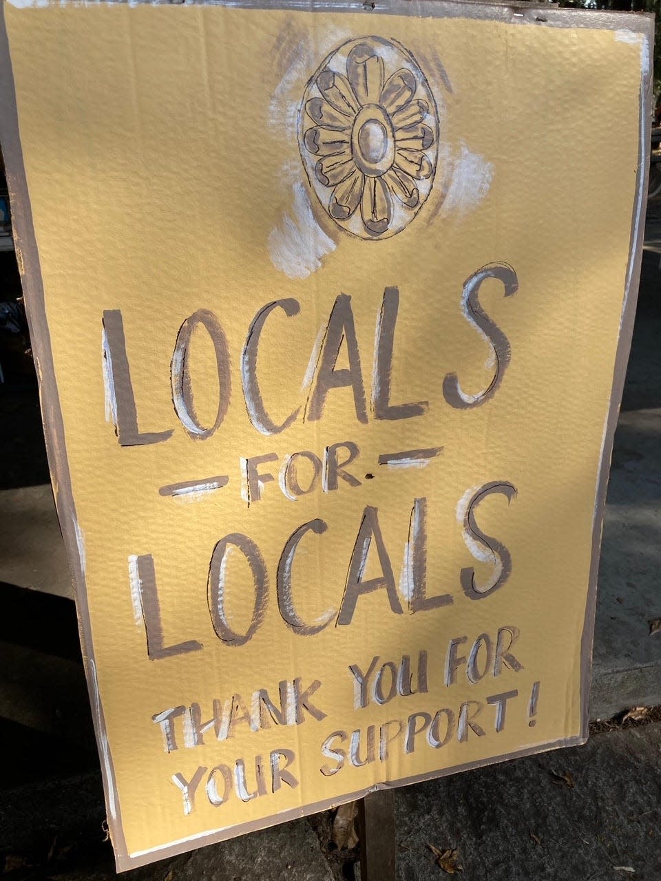 Old campaign posters are repurposed for signs promoting Gordonston Art Fair's slogan 'Locals for Locals' Courtesy Gordonston Art Fair Committee.