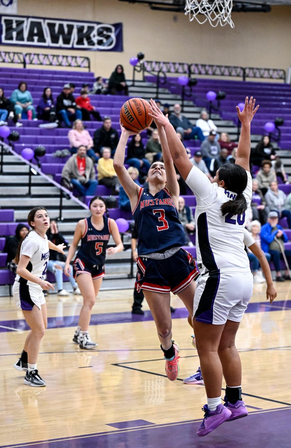 Mission Oak's Kaecyn Henderson defends against Tulare Western's Regina Toscano in a West Yosemite League high school girls basketball game Wednesday, January 10, 2024.